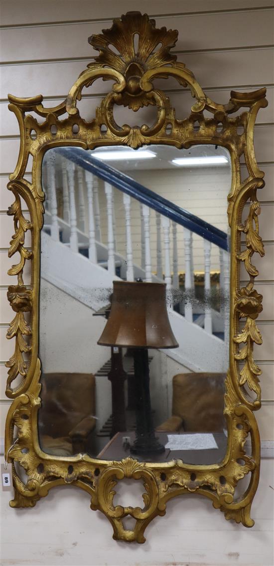 A George III carved giltwood wall mirror, W.65cm., H.130cm